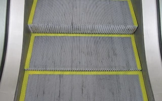 NON-SLIP COATING FOR ESCALATORS